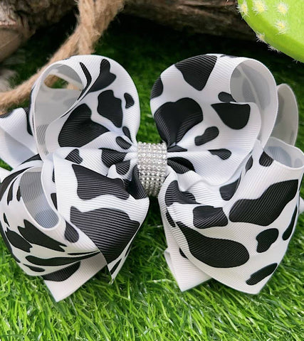 BLACK & WHITE COW SPOT PRINTED HAIR BOW.